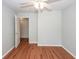 Cozy bedroom features wood-look floors, a ceiling fan, and access to a closet for storage at 133 Tall Spruce Rd, Moncks Corner, SC 29461