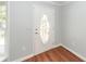 Bright entryway featuring a decorative front door, wood-look flooring, and fresh paint at 133 Tall Spruce Rd, Moncks Corner, SC 29461