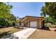 Beautiful home with a brick accent, attached garage, and driveway, showcasing its inviting curb appeal at 133 Tall Spruce Rd, Moncks Corner, SC 29461
