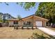 Charming single-story home featuring a brick accent, manicured lawn, and an attached one-car garage at 133 Tall Spruce Rd, Moncks Corner, SC 29461