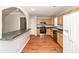 Updated kitchen with wooden cabinets, stainless steel appliances, and bar seating at 133 Tall Spruce Rd, Moncks Corner, SC 29461
