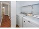 Laundry room featuring modern washer and dryer units with storage space at 133 Tall Spruce Rd, Moncks Corner, SC 29461