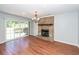 Living room features a brick fireplace and sliding glass doors at 133 Tall Spruce Rd, Moncks Corner, SC 29461