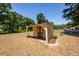 Charming shed features ample storage space, lattice details, and a cozy design at 133 Tall Spruce Rd, Moncks Corner, SC 29461