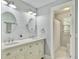 Bright bathroom with double sink vanity and an adjacent toilet room with a shower at 1410 Diamond Boulevard, Mount Pleasant, SC 29466