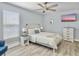 Relaxing bedroom featuring a ceiling fan, flat screen TV, and bright natural lighting at 1410 Diamond Boulevard, Mount Pleasant, SC 29466