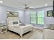 Comfortable bedroom with natural light, hardwood floors, and coastal-themed decor at 1410 Diamond Boulevard, Mount Pleasant, SC 29466