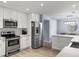Modern kitchen featuring stainless steel appliances, quartz countertops, and ample cabinet space at 1410 Diamond Boulevard, Mount Pleasant, SC 29466
