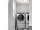 Convenient laundry room equipped with a modern washer and dryer set and stylish patterned flooring at 1410 Diamond Boulevard, Mount Pleasant, SC 29466