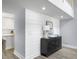 Elegant living space with shiplap accent wall, modern cabinet, and wood-look flooring at 1410 Diamond Boulevard, Mount Pleasant, SC 29466