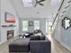 Cozy living room with a fireplace, modern lighting, vaulted ceiling, and comfortable seating area at 1410 Diamond Boulevard, Mount Pleasant, SC 29466