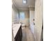 This full bathroom features a shower-tub combo, wainscotting, and tile flooring at 1425 Risher Mountain Rd, Walterboro, SC 29488