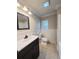 Bathroom showcasing the vanity, toilet, shower-tub combo, and window at 1425 Risher Mountain Rd, Walterboro, SC 29488