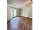 Large bedroom features wood-look floors and French doors to the exterior at 1425 Risher Mountain Rd, Walterboro, SC 29488