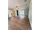 Spacious bedroom features wood-look floors, a ceiling fan, and French doors to a patio at 1425 Risher Mountain Rd, Walterboro, SC 29488