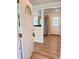 Inviting entryway with stylish wood-look floors and view into kitchen with stainless appliances at 1425 Risher Mountain Rd, Walterboro, SC 29488