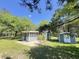 Home featuring a screened-in porch and storage building at 1425 Risher Mountain Rd, Walterboro, SC 29488