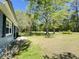 Spacious front yard showing landscaped grounds and an edge view of the home and lawn at 1425 Risher Mountain Rd, Walterboro, SC 29488