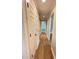 Hallway with hardwood floors and lots of storage and a view into the living room at 1425 Risher Mountain Rd, Walterboro, SC 29488