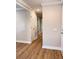 Hallway with hardwood floors and a view of the home's interior and multiple storage closets at 1425 Risher Mountain Rd, Walterboro, SC 29488