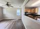Open-concept living room and kitchen with hardwood floors and modern finishes is perfect for entertaining at 1425 Risher Mountain Rd, Walterboro, SC 29488