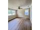 Spacious living room with great light features a ceiling fan and wood-look floors at 1425 Risher Mountain Rd, Walterboro, SC 29488