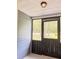 Screened porch featuring a black metal door at 1425 Risher Mountain Rd, Walterboro, SC 29488