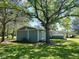 Yard view of side of home with AC and screened in back porch at 1425 Risher Mountain Rd, Walterboro, SC 29488