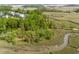 Scenic aerial view showcasing the community backing up to the marsh and winding creek at 148 Cowrie Ct, Mount Pleasant, SC 29464