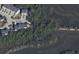 Aerial view showing a property surrounded by marshland, offering privacy and natural beauty at 148 Cowrie Ct, Mount Pleasant, SC 29464