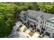 Aerial view of townhomes with private driveways surrounded by mature trees and manicured landscaping at 148 Cowrie Ct, Mount Pleasant, SC 29464