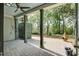 Covered back patio with a ceiling fan, pavers and an outdoor fireplace at 148 Cowrie Ct, Mount Pleasant, SC 29464