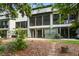 A spacious backyard featuring a patio and screened-in porch, perfect for outdoor relaxation and entertaining at 148 Cowrie Ct, Mount Pleasant, SC 29464