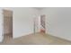 A bright bedroom features neutral carpet and an open doorway to a walk-in closet at 148 Cowrie Ct, Mount Pleasant, SC 29464
