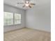 Bedroom with neutral carpet, ceiling fan and windows offering plenty of natural light at 148 Cowrie Ct, Mount Pleasant, SC 29464