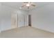 Empty bedroom with a connecting bathroom and closet, neutral carpet, and good lighting at 148 Cowrie Ct, Mount Pleasant, SC 29464