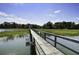 A wooden boardwalk stretches across a marsh, providing a scenic walking path at 148 Cowrie Ct, Mount Pleasant, SC 29464