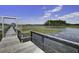 Scenic marsh view featuring a wooden boardwalk and a lush coastal landscape under a bright blue sky at 148 Cowrie Ct, Mount Pleasant, SC 29464