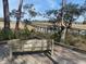 Elevated wooden boardwalk and bench offer scenic views of the surrounding marshland and tranquil waterways at 148 Cowrie Ct, Mount Pleasant, SC 29464