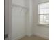 Walk-in closet with metal shelving and a window for natural light at 148 Cowrie Ct, Mount Pleasant, SC 29464