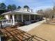 Spacious community clubhouse featuring a covered porch, well-maintained landscaping, and ample parking at 148 Cowrie Ct, Mount Pleasant, SC 29464