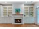 A cozy fireplace framed by custom built-ins provides a focal point in this inviting living area at 148 Cowrie Ct, Mount Pleasant, SC 29464