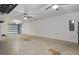Spacious garage with ample room for parking and storage, complete with ceiling fans and functional lighting at 148 Cowrie Ct, Mount Pleasant, SC 29464