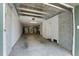 Spacious garage with ample room for parking and storage, complete with ceiling fans and functional lighting at 148 Cowrie Ct, Mount Pleasant, SC 29464