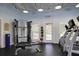 Well-equipped fitness center featuring exercise equipment and natural light from large windows at 148 Cowrie Ct, Mount Pleasant, SC 29464