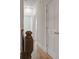 Hallway with hardwood floors, white doors, and wooden railings, offers a glimpse into other rooms at 148 Cowrie Ct, Mount Pleasant, SC 29464