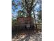 Historic brick ruins surrounded by trees, featuring informative signage and a rustic wooden fence at 148 Cowrie Ct, Mount Pleasant, SC 29464