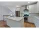 Modern kitchen with stainless steel appliances, a central island, and ample counter space, perfect for culinary enthusiasts at 148 Cowrie Ct, Mount Pleasant, SC 29464