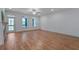 Expansive living area featuring hardwood floors, natural light, and access to outdoor space for seamless indoor-outdoor living at 148 Cowrie Ct, Mount Pleasant, SC 29464