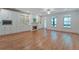 Sunlit living space with hardwood floors, fireplace, and built-in shelves offers a bright and inviting atmosphere at 148 Cowrie Ct, Mount Pleasant, SC 29464